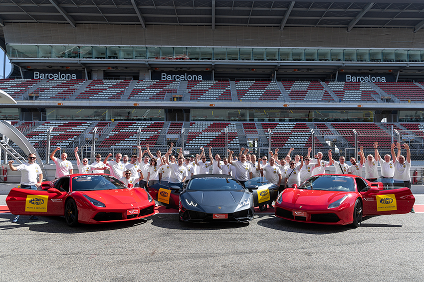 Performance vehicles branded Magneti Marelli Parts & Services at Circuit de Montmeló with Polish partners in branded shirts
