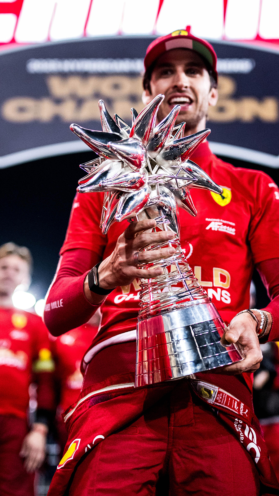 Antonio Giovinazzi smiling with the WEC 2025 Drivers’ Championship trophy after the race in Bahrain