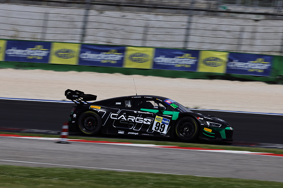 GT Supercar racing at Misano with Magneti Marelli Checkstar logo on the door and branded trackside billboards in the background